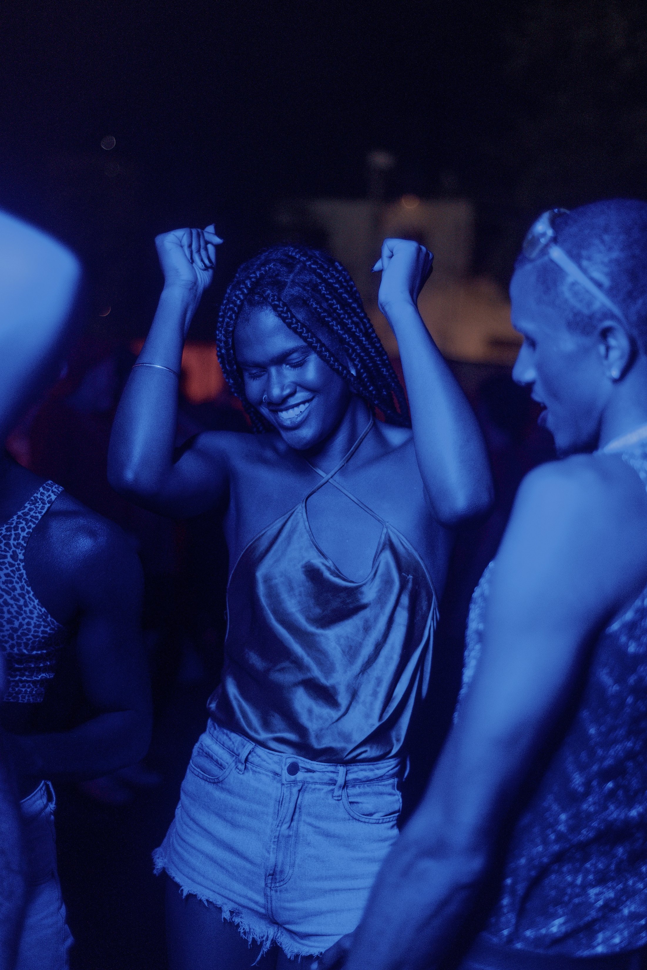 Non-Binary Friends Dancing in Night Club